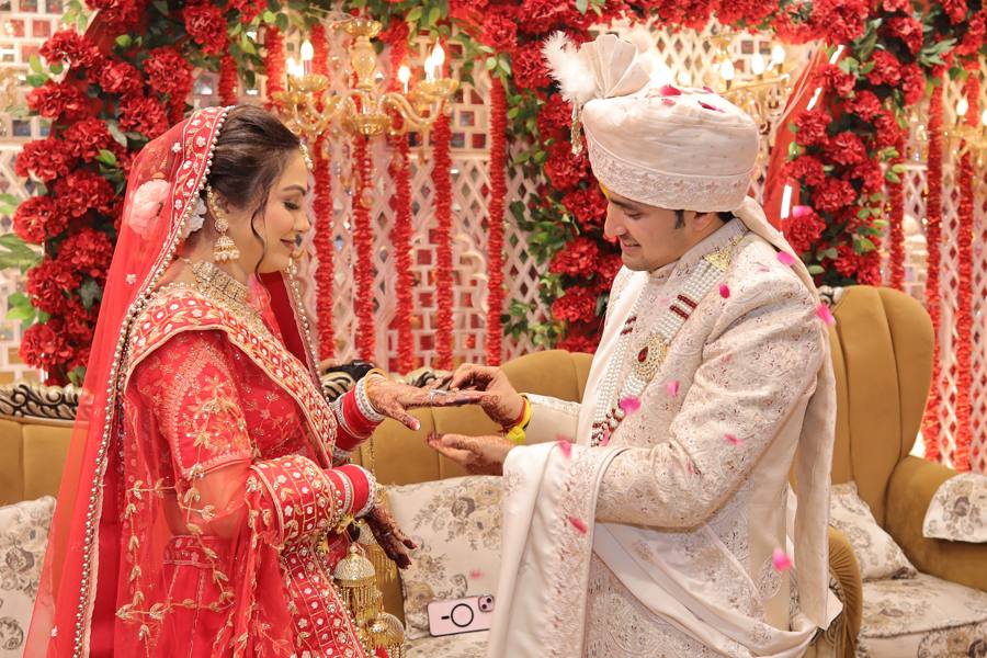 Ring ceremony of a couple matched by Wedding Tales
